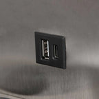Port USB noir intégré dans l’applique murale en acier avec chargeur sans fil