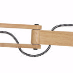 Bras de lampe articulé en bois naturel avec cordon noir et blanc pour l’applique murale