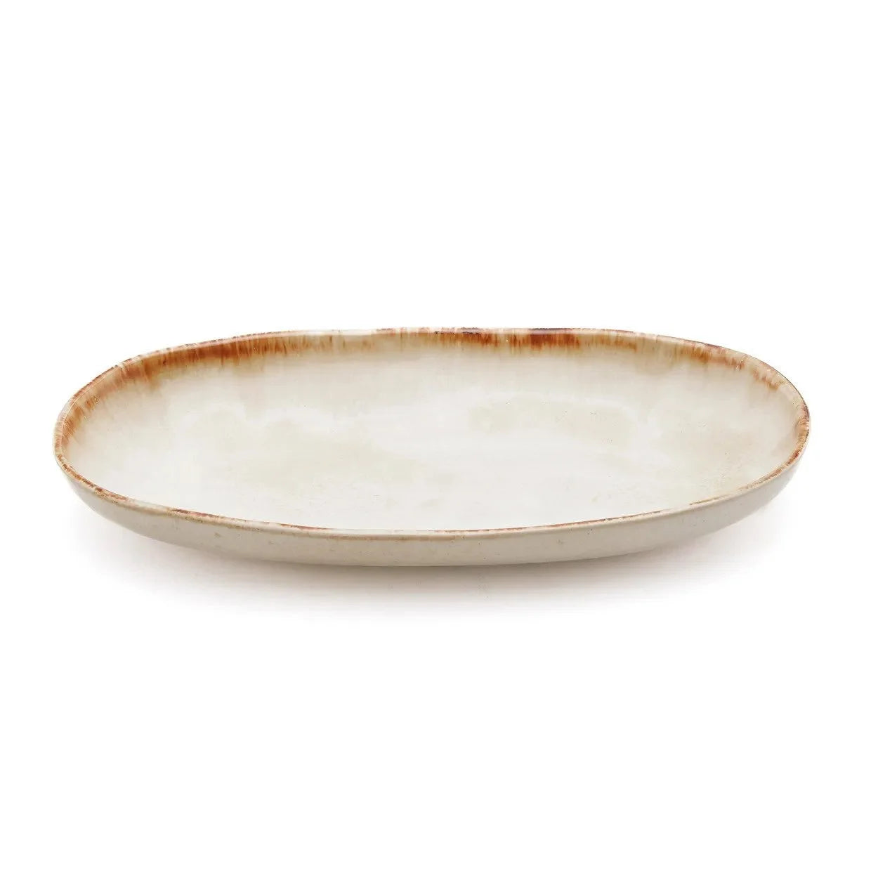 Assiette ovale en céramique blanche et brune finition artisanale avec rebord rustique