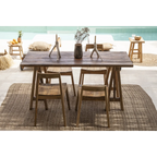 Table à manger en bois foncé avec quatre chaises sur un tapis texturé près du Bougeoir blanc en forme de branche organique