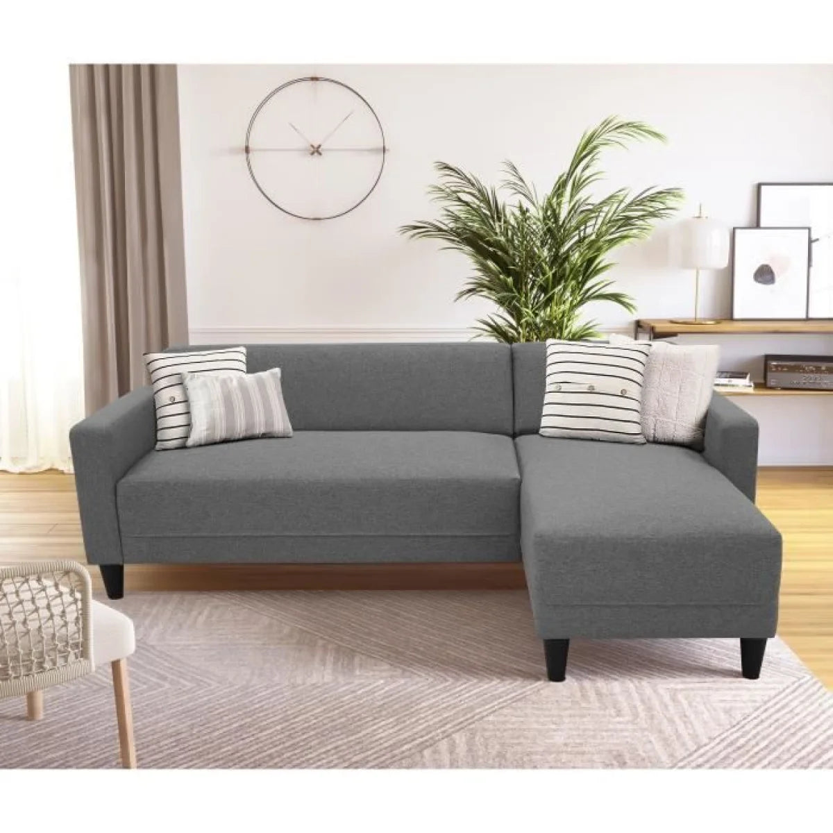Canapé d’angle réversible en tissu anthracite avec méridienne droite, gris avec coussins rayés