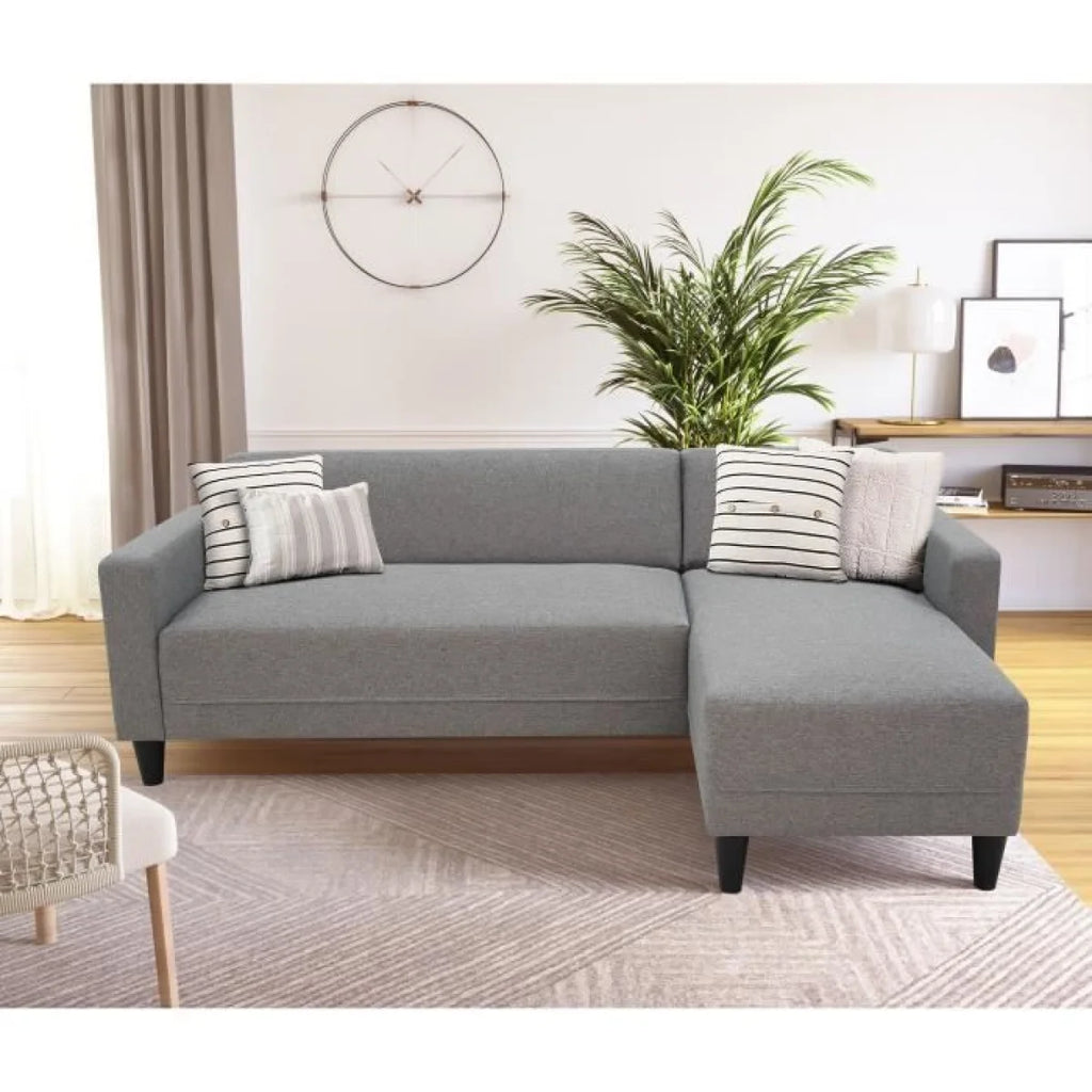 Canapé d angle réversible en tissu gris chiné avec méridienne et coussins rayés