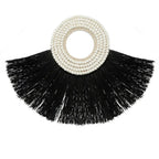 Tasseled black fan with white beaded circular handle from Décoration murale en alang-alang