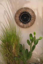 Décoration murale ronde en raphia et macramé noir avec centre noir de 60 cm