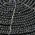 Abschluss de verre perlé noir en arrangement circulaire pour décoration élégante