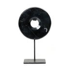 Disque en marbre noir sur support en métal pour décoration élégante