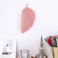 Feuille murale en macramé rose pâle, douce et féminine, parfaite pour une décoration murale bohème