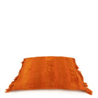 Coussin carré en velours rouille avec franges orange de 60x60 cm