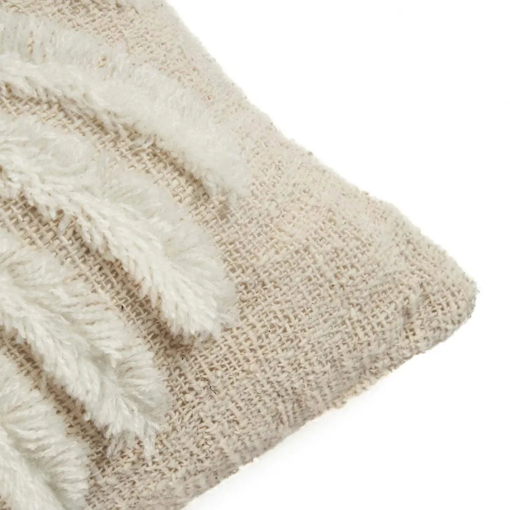 Coussin en coton blanc naturel avec motif palmier stylisé, texture tissée et franges décoratives