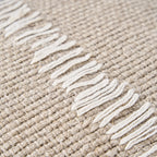 Tapis tissé naturel en jute avec franges blanches et motif texturé