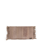 Tapis rectangulaire beige en velours côtelé avec franges, idéal pour la décoration
