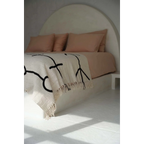 Jeté de lit en coton noir naturel motif œil protecteur et franges