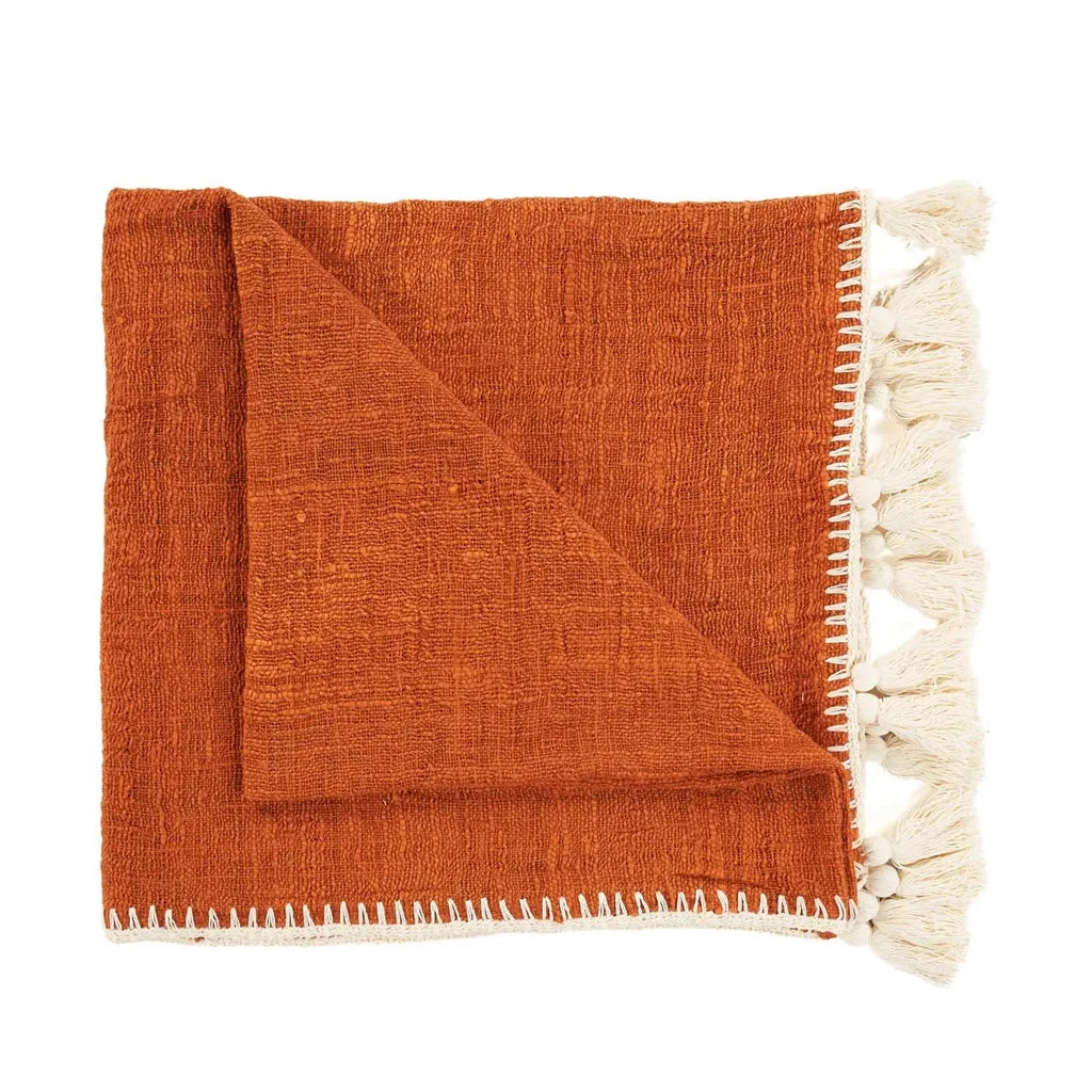 Jeté de lit Stitch Terre Cuite plié avec franges orange pour la décoration et le confort