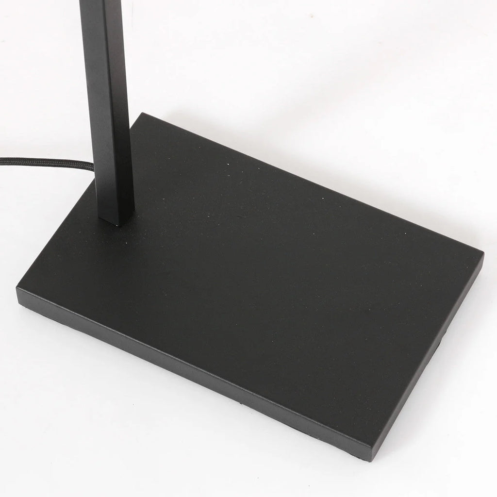 Base de lampadaire en métal noir avec support vertical et cordon électrique