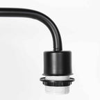 Bras de lampe en métal noir avec douille filetée blanche et abat-jour cylindrique