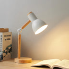 Lampe en bois articulée avec finition blanche, design scandinave et bras pivotant, idéale pour un bureau ou une chambre bohème.
