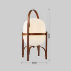 Lampe à pied en bois sombre de petite taille avec abat-jour blanc