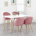 Lot de 4 chaises modernes roses autour d’une table blanche