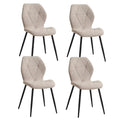 Lot de 4 chaises en tissu blanc avec pieds en métal noir, style moderne.