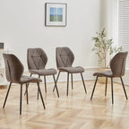 Ensemble de 4 chaises en tissu gris, installées autour d'une table dans une salle à manger.