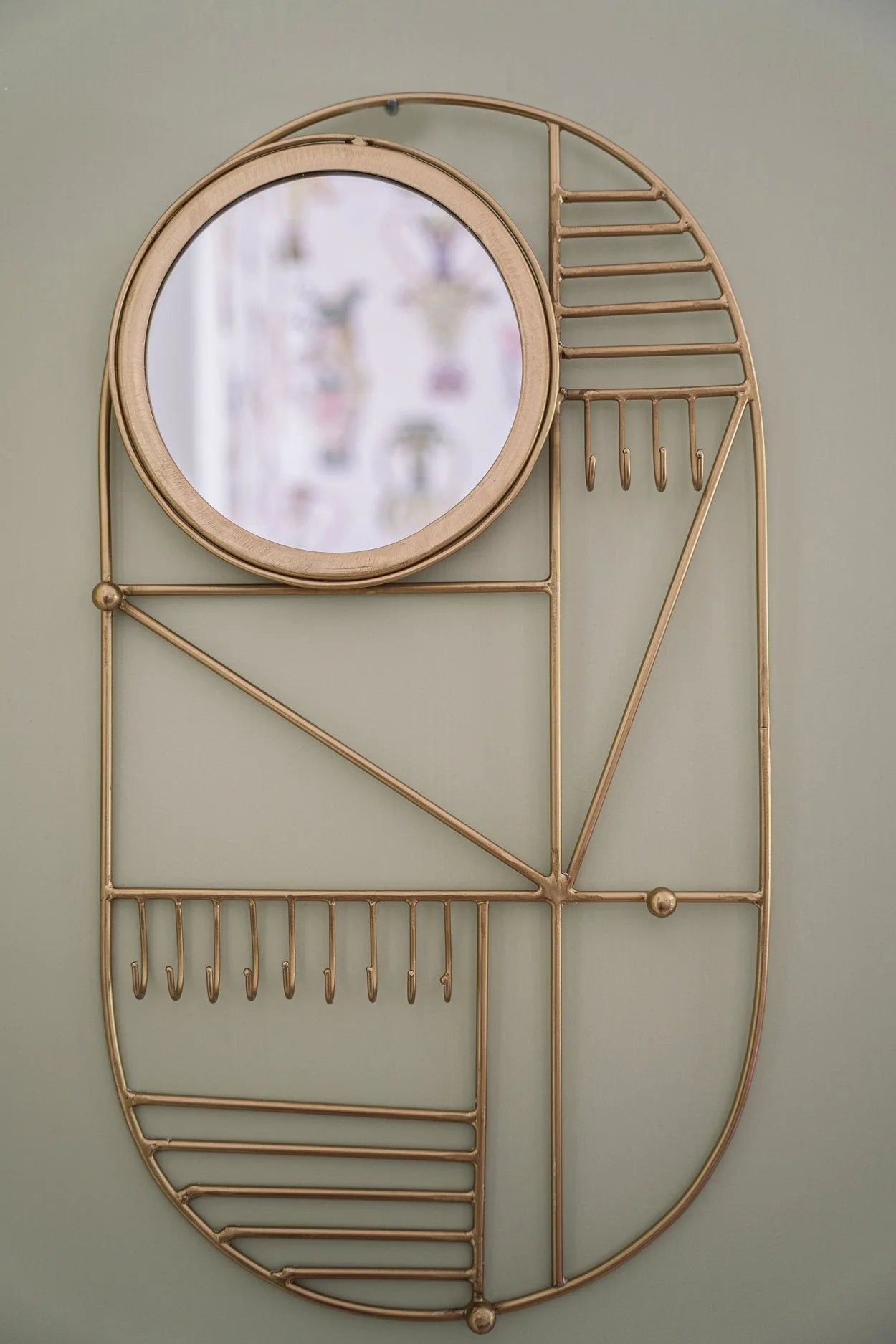 Organisateur mural doré avec miroir rond et crochets en métal pour bijoux