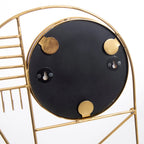 Dos d’un miroir rond noir avec cadre en or et crochets en métal, pour décoration murale