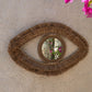 Miroir mural en raphia forme œil 70x40 cm