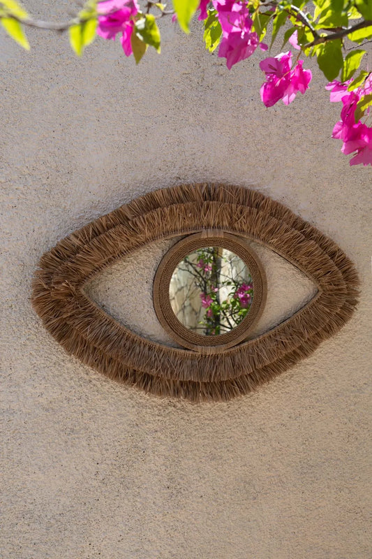 Miroir mural en raphia forme œil 70x40 cm