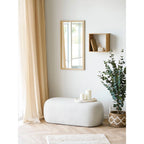 Ottoman ovale blanc rembourré pour salon ou chambre dans un style moderne