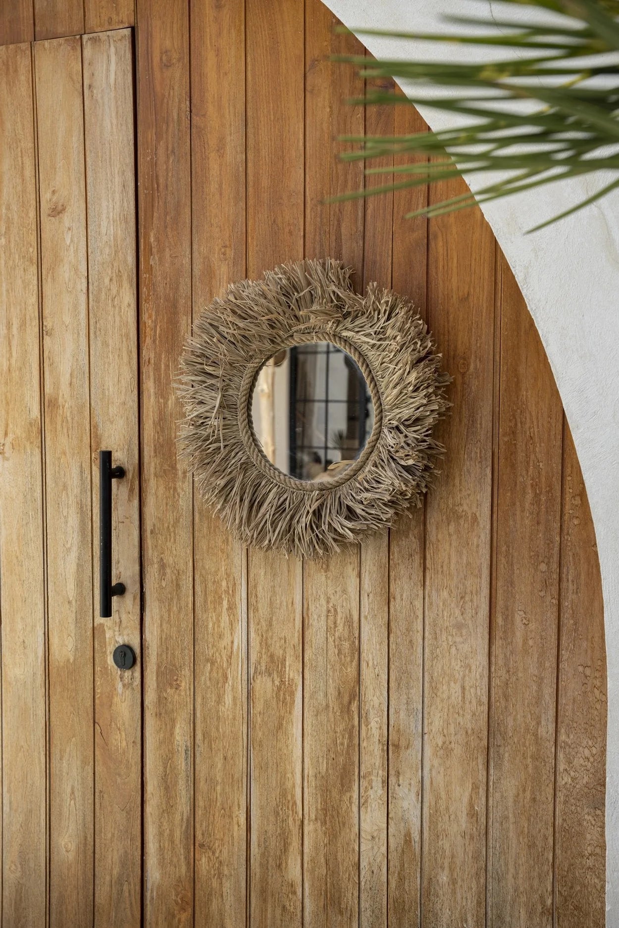 Miroir mural rond en fibres naturelles tressées avec frange de paille, diamètre 60 cm
