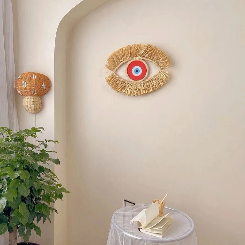 Décoration murale œil protecteur rouge en paille, style bohème artisanal