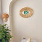 Oeil décoratif mural vert en paille naturelle, pour un intérieur chaleureux