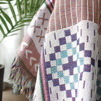Plaid nordique coloré avec franges multicolores, parfait pour la déco de salon ou chambre