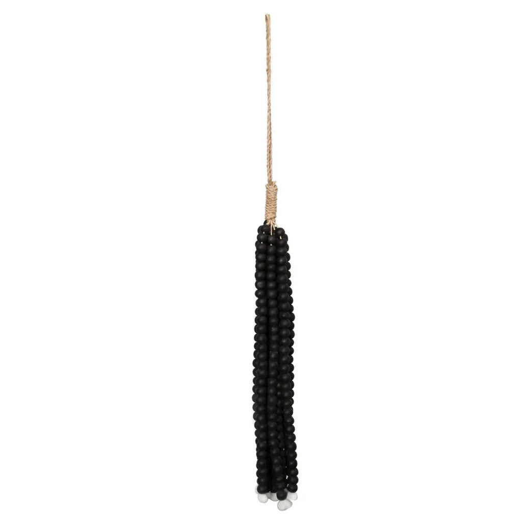 Tassel en perles de bois noires suspendu par un cordon naturel pour mur décoration