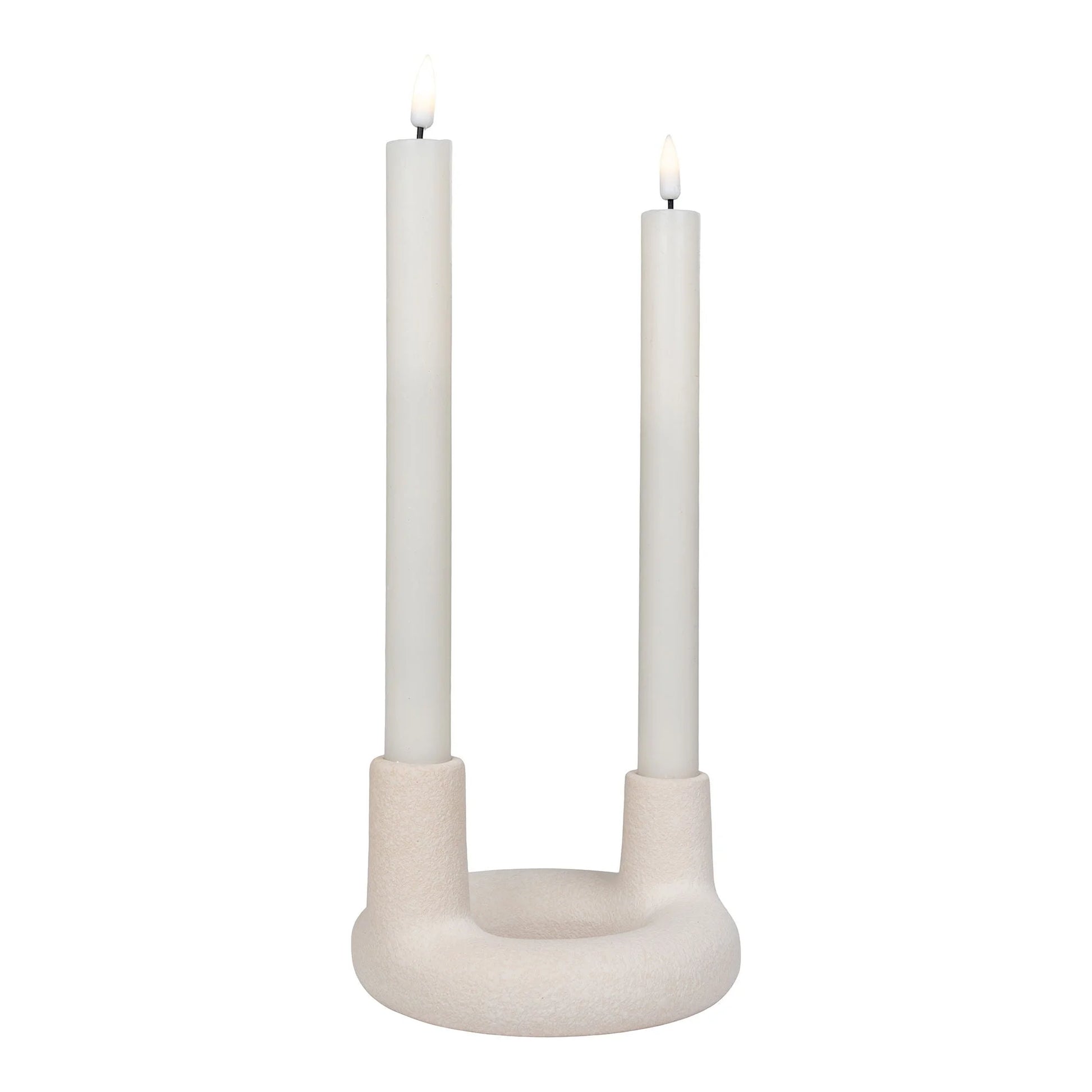 Bougies allumées dans un porte-bougie en céramique beige rond ø13 cm