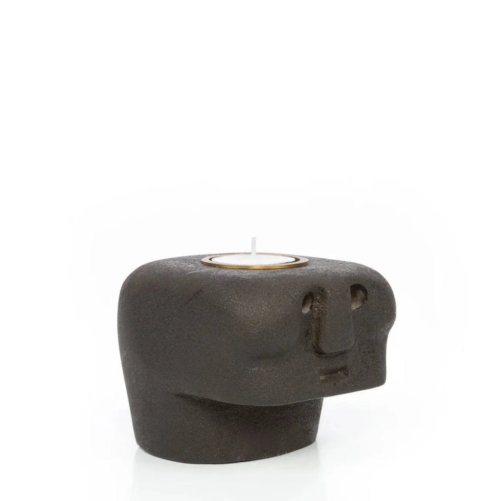 Porte-bougie en grès noir visage stylisé avec bougie tealight allumée