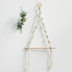 Porte-papier toilette mural en bois et macramé sans accessoires, suspendu sur mur blanc