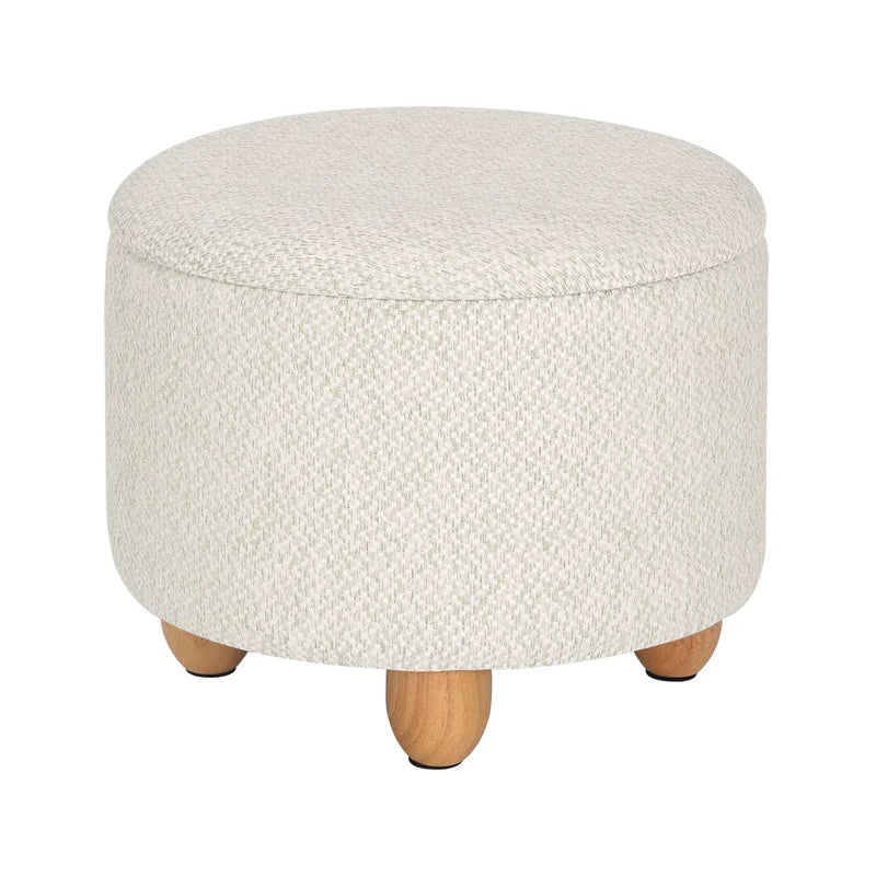 Pouf de rangement rond couleur crème fermé avec pieds en bois massif.