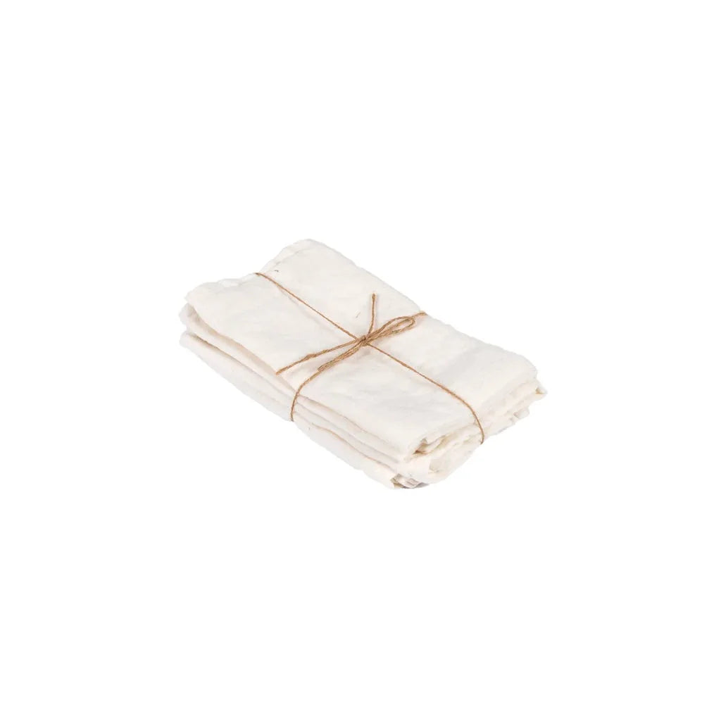 Pile de serviettes blanches attachées avec de la ficelle.