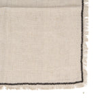 Serviette de table en lin naturel beige texturé avec bordure noire contrastante