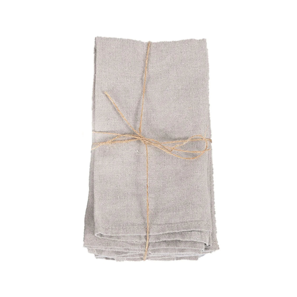 Serviettes de table en lin naturel beige empilées et nouées avec de la ficelle