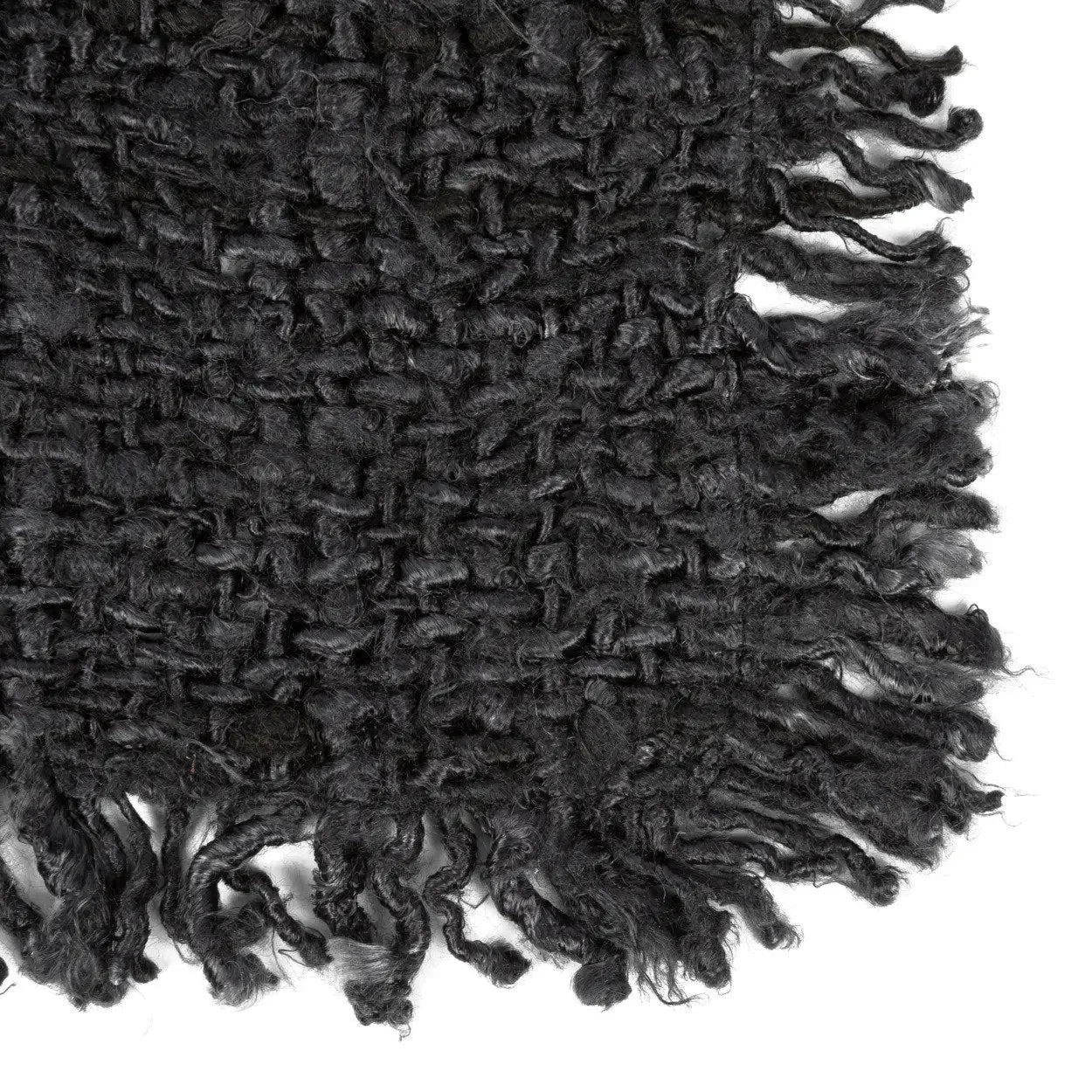 Tapis en laine bouclée noire texturée dense aux franges