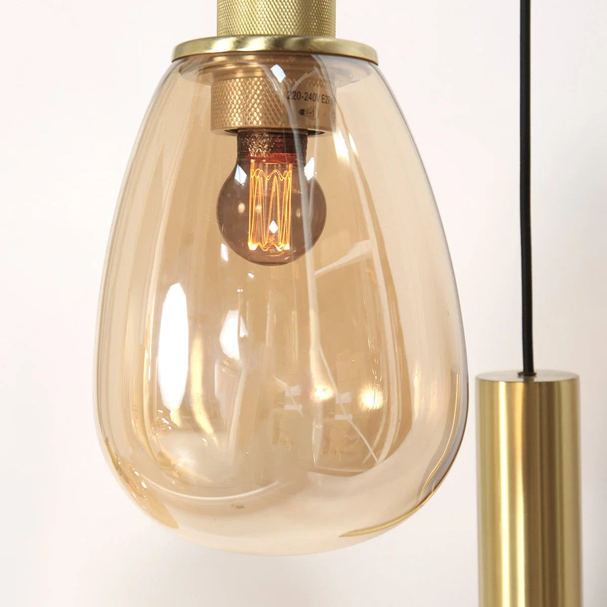 Suspension multiple en verre ambré et laiton doré pour éclairage chaleureux – 140x44 cm