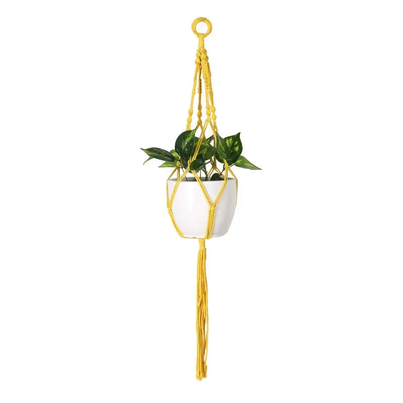 Suspension plante en macramé jaune avec pot de plantes moderne et tressée