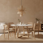 Suspension en rotin naturel ajouré forme fleur Ø65 cm au-dessus table