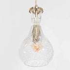 Suspension en verre taillé transparente avec fixation en laiton doré et ampoule à filament