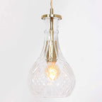 Suspension en verre taillé transparente avec fixation en laiton doré et ampoule à filament