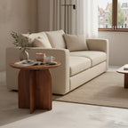 Canapé beige capitonné lignes épurées coussins assortis