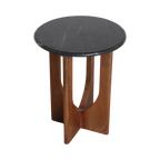 Table d’appoint ronde en marbre noir et bois sculpté, H50 cm