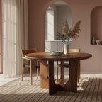 Table ronde en bois massif brun, pied sculptural croisé, Ø120 cm